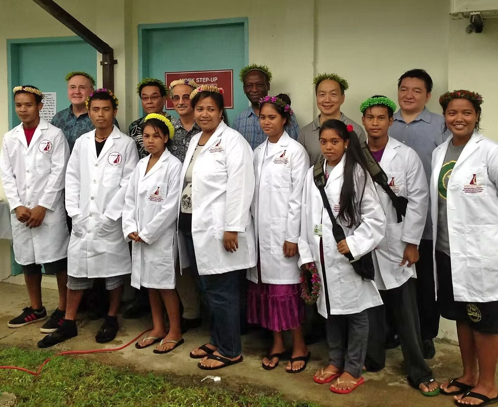 micronesia students in lab coats