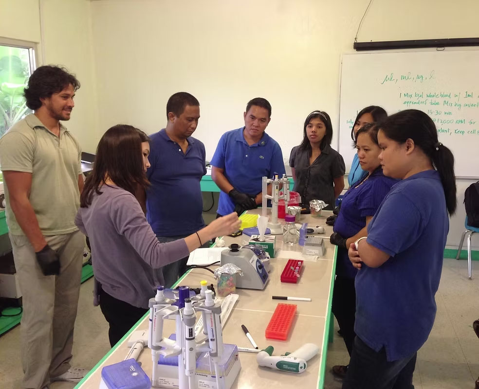 students and teachers in palau lab